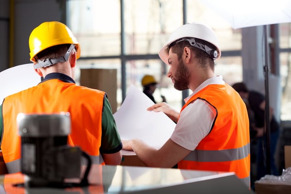 Male factory worker and supervisor are analyzing plans Image: Shutterstock