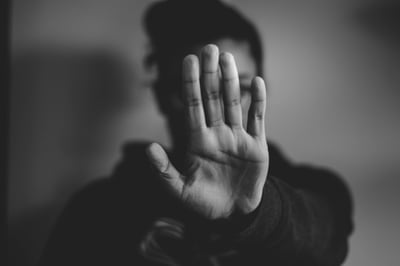 woman showing stop sign with hand Credit: Nadine Shaabana Unsplash